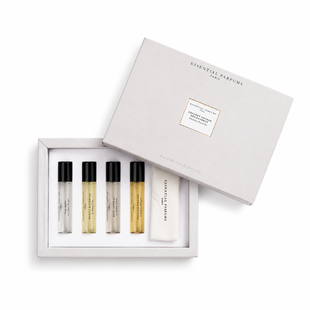 Coffret Voyage Discovery Travel Set Essential Parfums 4 × 10 ml ouvert avec quatre parfums de niche et une trousse en tissu sur fond blanc.