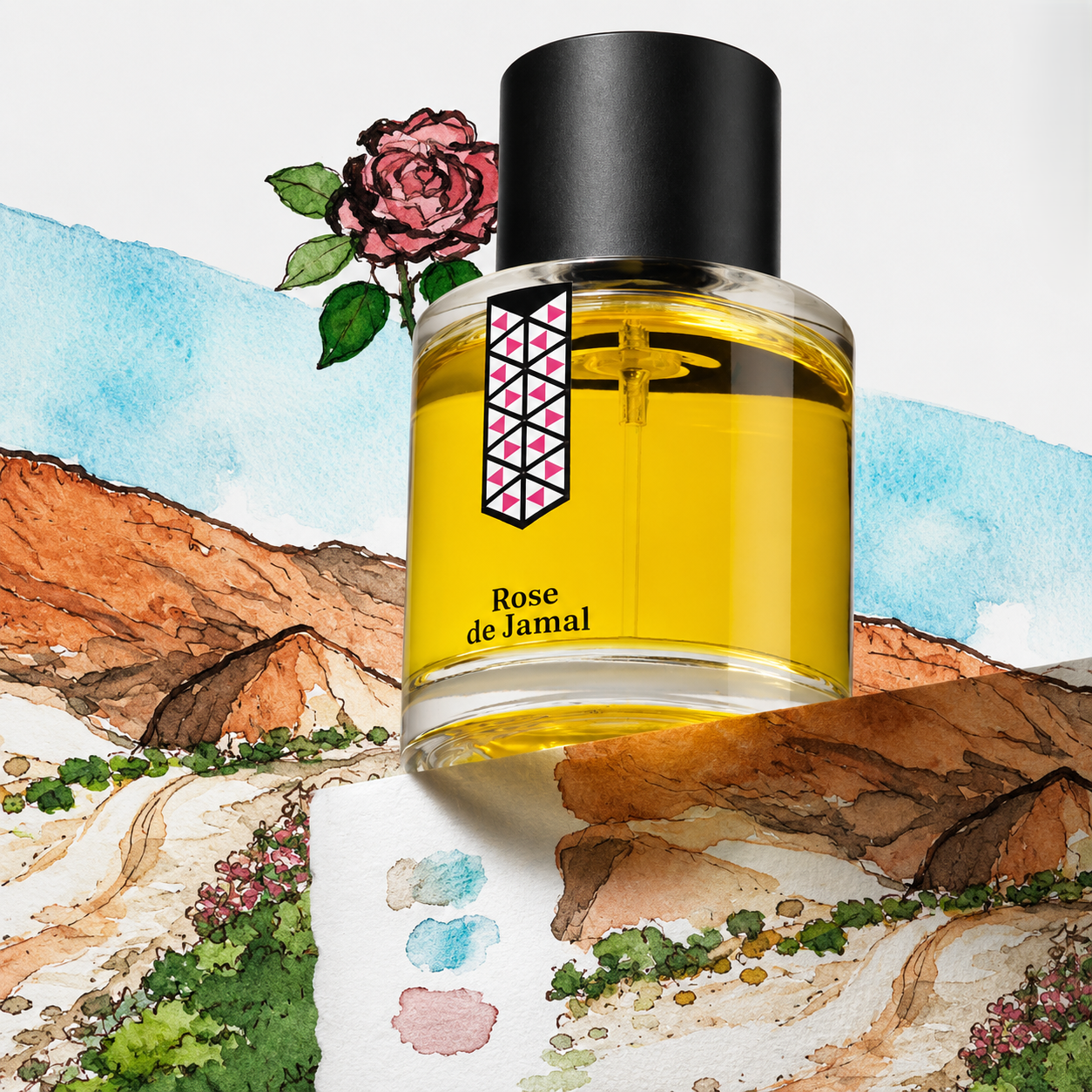 Rose de Jamal de Les Indémodables, eau de parfum 50 ml, mise en scène avec une rose et des montagnes rocheuses ocre.